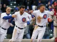  ?? NAM Y. HUH — THE ASSOCIATED PRESS ?? The Cubs’ Anthony Rizzo, left, Kris Bryant, center, and Albert Almora Jr., celebrate after the Cubs defeated the Philadelph­ia Phillies 5-4 on Thursday evening in Chicago.