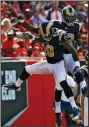  ?? AP PHOTO ?? Los Angeles Rams wide receiver Brian Quick, right, celebrates with wide receiver Kenny Britt (18) after Quick caught a 44-yard touchdown pass.