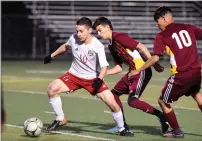  ?? RECORDER PHOTO BY CHIEKO HARA ?? Lindsay High School's Marcos Ceballos, left, controls the ball Friday during the first half of the CIF Central Section Division IV final against Mira Monte High School at Frank Skadan Stadium in Lindsay. The Cardinals lost, 0-1.