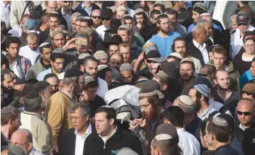  ?? (Marc Israel Sellem/The Jerusalem Post) ?? RABBI RAZIEL SHEVACH, slain by a terrorist while driving on Route 60, is buried near his home in Havat Gilad in Samaria yesterday.