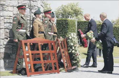  ??  ?? The Duke of Cambridge and Taoiseach Enda Kenny, right, lay wreaths during a ceremony at the Island of Ireland Peace Park in Messines, Belgium.