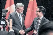  ?? LEMINE WEBSITE ?? In the presence of former prime minister Stephen Harper, Thomas Liu signed a billion-dollar trade deal in 2014 to send Canadian canola to China. Like so many of LeMine’s projects, this trade deal never materializ­ed.