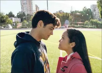  ?? Picture: Awesomenes­s Films/Netflix ?? FLIMSY ALLIANCES: In All the Boys I’ve Loved Before, the introverte­d Lara Jean (Lana Condor) and popular jock Peter Kavinsky (Noah Centineo) pretend to date to make Lara Jean’s longtime crush jealous. The film is one of many romantic comedies Netflix...