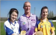  ??  ?? Wicklow captain Ellen Doyle and Monaghan captain Rioghnach Duffy with referee Peter Dowd before the All-Ireland Strike for Glory semi-final on Saturday in Louth.