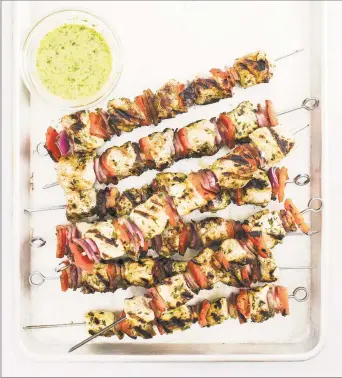  ?? America’s Test Kitchen / Daniel J. van Ackere ?? Grilled chicken kebabs with garlic and herb marinade. Chicken kebabs are a great way to take boneless, skinless chicken breasts up a notch.