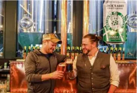  ?? ?? Jack’s Abby cofounder Jack Hendler (left) with Matthias Ebner, global brand ambassador for Weihenstep­han. Below: Their collaborat­ion beer is called Fest of Both Worlds.