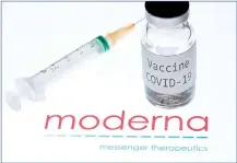  ?? — AFP photo ?? This file photo shows a syringe and a bottle reading ‘Vaccine Covid-19’ next to the Moderna biotech company logo.