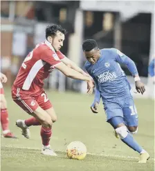  ??  ?? Siriki Dembele on the attack for Posh against Scunthorpe.