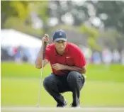  ?? AP PHOTO/PHELAN M. EBENHACK ?? Tiger Woods lines up a putt on the second green during the final round of the Arnold Palmer Invitation­al golf tournament Sunday, March 18, in Orlando, Fla.