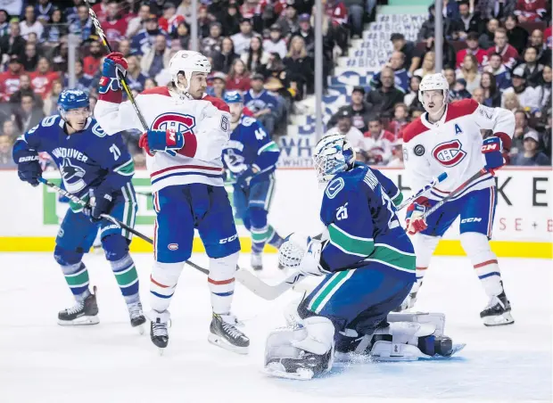  ?? DARRYL DYCK/THE CANADIAN PRESS ?? Goalie Jacob Markstrom and the Canucks were beaten by the Canadiens on a late goals on Saturday night.