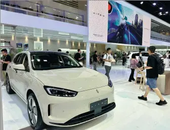  ?? LI FUSHENG / CHINA DAILY ?? Seres showcases the Aito M5, co-developed with Huawei, at the Chengdu auto show in August.