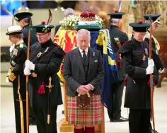  ?? ?? King Charles III, Princess Anne, Prince Andrew and Prince Edward conducted the 'Vigil of the Princes' as their mother's coffin laid in state: Princess Anne made history at the Vigil of the Princes ceremony as the first female member of the Royal Family to 'stand guard'. All eight grandchild­ren, including the Queen's granddaugh­ters, Princess Beatrice, Princess Eugenie, Zara Tindall and Lady Louise Windsor, held a second vigil, standing solemn guard around the coffin.