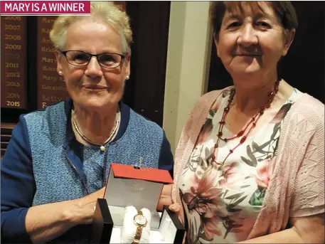  ??  ?? Lady captain’s day winner Mary Kennedy is presented with her prize by Ladies Captain Agnes Durkin who hosted her day last Saturday.