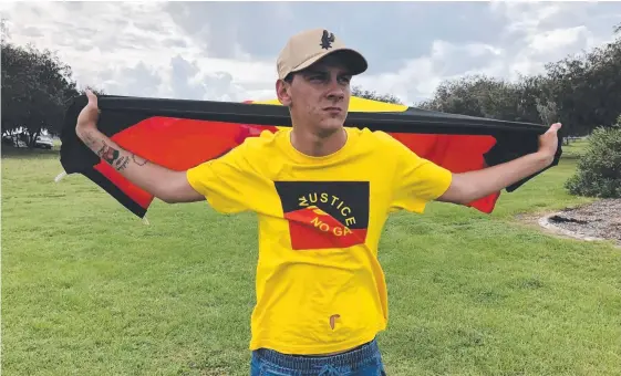  ??  ?? Dylan Voller at a protest during the Queen’s Baton Relay on the Gold Coast. He has lauched a crowd-funding appeal to raise money for a treatment facility – and his 21st birthday party.