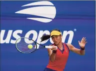  ?? Elise Amendola / Associated Press ?? Emma Raducanu returns a shot to Belinda Bencic during the quarterfin­als of the U.S. Open on Wednesday.