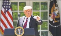  ?? Mandel Ngan / AFP/Getty Images ?? President Donald Trump gestures as he delivers remarks on immigratio­n at the Rose Garden of the White House on Thursday.