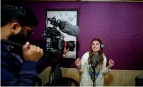  ?? Reuters ?? Malala Gul, a local singer, performs to record a song at a studio in Peshawar.—