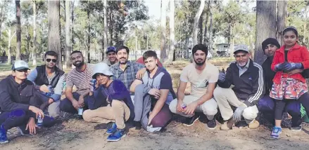  ??  ?? Australia’s young Ahmadiyya Muslims help plant trees at an event last month.