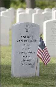  ?? ?? The ceremony was held at the Fort Devens Post Cemetery where the graves of many who died defending the country are located. Above is the grave of Andre B. Van Hoogen, who fought in both World War II and the Korean War.