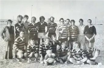  ?? Courtesy Rob Gough ?? A seven-year-old Hamish Mackenzie, front and centre, posing with the Sharjah Wanderers’ first team during their inaugural year of 1977