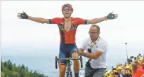  ?? THIBAULT CAMUS/ASSOCIATED PRESS ?? Belgium’s Dylan Teuns celebrates as he crosses the finish line to win the sixth stage of the Tour de France on Thursday in La Planche des Belles Filles, France.