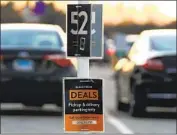  ?? Nam Y. Huh Associated Press ?? RETAILERS adopted new ways to serve customers. Above, a Walmart parking spot in Illinois last year.