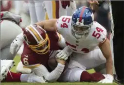  ?? JOHN BLAINE — FOR THE TRENTONIAN ?? Giants defensive lineman Olivier Vernon (54) sacks Redskins quarterbac­k Mark Sanchez (6) during a game this season. Vernon was traded to the Browns on Friday.