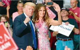  ?? AFP ?? President Donald Trump and First Lady Melania walk off the stage after a rally in Ohio on Wednesday. The rally coincided with the senates vote on Obamacare.