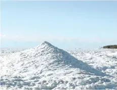  ?? DAVE JOHNSON/WELLAND TRIBUNE ?? With ice mounds, ice volcanoes and small ice caves forming at Waterfront Park in Crystal Beach, Fort Erie Fire Department Chief Ed Melanson is monitoring conditions. He says the formations are a "little underwhelm­ing" compared to ice caves that formed...