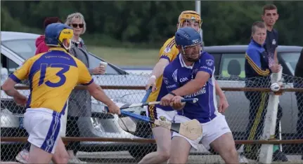  ??  ?? Noel Dempsey (Our Lady’s Island) tries to clear under pressure from Michael O’Gorman (Taghmon-Camross) in the IAHC tie.