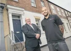  ??  ?? Dan Makaveli (right) with city council leader Coun Graeme Miller outside Media Savvy’s new offices