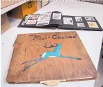  ?? EDDIE MOORE/JOURNAL ?? Pop Chalee painted one of her trademark deer on the wooden cover of this scrapbook, which is now in the IAIA archives.