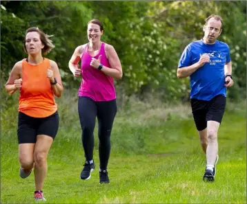  ??  ?? A group of United Striders athletes availing of the easing of Covid-19 restrictio­ns on their return to training at the C.B.S. Park in New Ross.