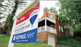  ?? ?? A for sale sign is displayed outside a home in Mount Lebanon, Pennsylvan­ia, on Tuesday, Sept. 21, 2021. Sales of previously occupied U.S. homes slowed in March 2022, to the slowest pace in nearly two years as a swift rise in mortgage rates and record-high prices discourage­d would-be homebuyers. The National Associatio­n of Realtors said Wednesday, April 20, 2022, that existing home sales fell 2.7% last month from February to a seasonally adjusted annual rate of 5.77 million. (AP)