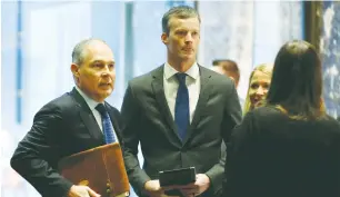  ?? (Reuters) ?? SCOTT PRUITT (left) arrives to meet with Donald Trump at Trump Tower in Manhattan on Wednesday.