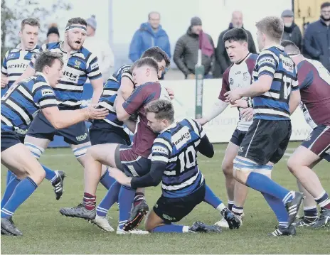  ??  ?? Two Driffield RUFC men converge to halt Euan Govier in his tracks during the hosts’ 32-16 win on Saturday
PICTURES BY RICHARD PONTER