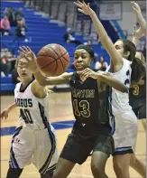  ?? Dan Watson/The Signal ?? Saugus teammates Ashlyn Canel (40), left, and Eden MacKenzie (20), right, knock the ball loose from Canyon’s Chidinma Okafor (13).