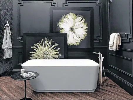  ?? POSTMEDIA ?? The DXV Modulus bathtub and tub filler have a statuesque, sculptural quality.