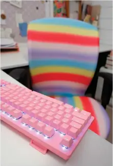  ??  ?? My colourful keyboard won’t be alone with the rainbowcov­ering for my office chair.