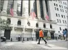  ?? MARK LENNIHAN - THE AP ?? In this July 21 file photo, people walk by the New York Stock Exchange. Stocks keep ticking higher on Wall Street, and more gains for the S&P 500 Friday morning, Aug. 28 have it on pace to close out its fifth straight winning week.