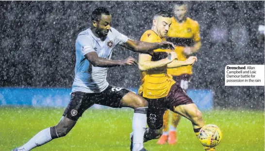  ??  ?? Drenched Allan Campbell and Loic Damour battle for possession in the rain