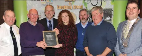  ??  ?? Emma Hunt-Duffy presents the Fyffe’s Special Merit Award to Owen Kirwan, Bobby Aspall and John Maguire, Termonfeck­in Tidy Towns