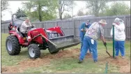  ?? Westside Eagle Observer/SUSAN HOLLAND ?? Members of the Gravette Lions Club begin constructi­on Saturday on the human foosball court at Pop Allum Park. Jerry Hallum of Colcord, Okla., delivers a batch of concrete in the scoop of his tractor as Jeff Davis, Al Blair and Sue Rice install posts.