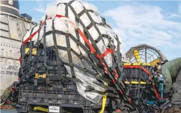  ?? PETTY OFFICER 1ST CLASS RYAN SEELBACH U.S. NAVY VIA AP ?? U.S. Navy sailors prepare material from the downed Chinese high-altitude balloon recovered off the coast of Myrtle Beach, S.C., for transport to the FBI. Officials say the military has finished debris recovery efforts.