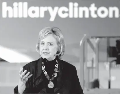  ?? Associated Press ?? Democratic presidenti­al candidate Hillary Clinton speaks during a campaign stop Friday in Sioux City, Iowa. As a young girl growing up in suburban Chicago, Hillary Rodham decided she’d never change her last name—no matter who she ended up marrying....