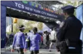  ?? RICHARD DREW — THE ASSOCIATED PRESS ?? A New York City police office stands near the finish line of the New York City Marathon in New York’s Central Park.