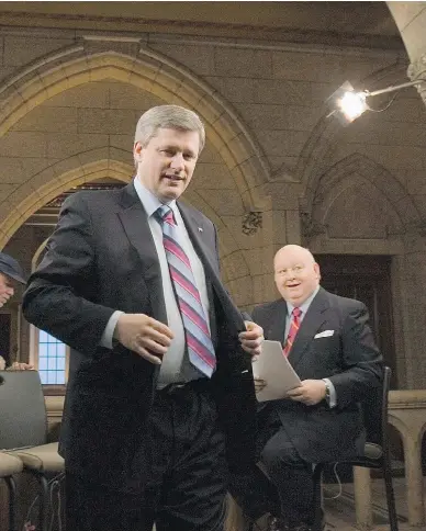  ?? TOM HANSON / THE CANADIAN PRESS ?? Prime Minister Stephen Harper walks away following a television interview with Mike Duffy in 2007. Harper’s lawyer maintains that the former prime minister had no influence in the decision to charge and prosecute Sen. Duffy.