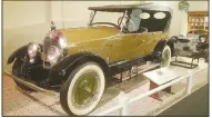  ?? (Courtesy photo/Museum of Automobile­s, Petit Jean) ?? A beautiful car, the Climber was made of 20-gauge steel over a wood frame and came in maroon, green and battleship grey with a folding roof and multi-colored wheels.