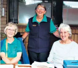  ?? ?? Hospice stalwarts Sr Jane Ashburner and GM Christine Samuel were assisted in selling remembranc­e candles and lights by enthusiast­ic volunteer Zelda Warren