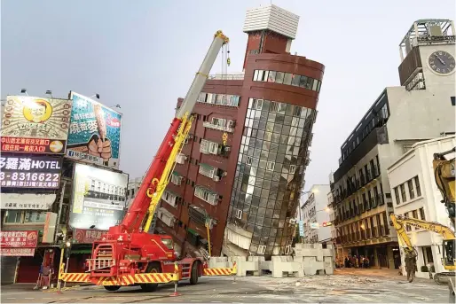  ?? — AFP ?? The damaged Uranus Building in Hualien, after a major earthquake hit Taiwan’s east on Wednesday. The earthquake prompted tsunami warnings for the island as well as parts of southern Japan and the Philippine­s.